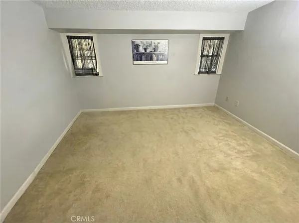 a view of a room with window and wall painting