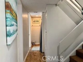 a bedroom with a bed lamp and a large window