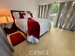 an empty room with large windows