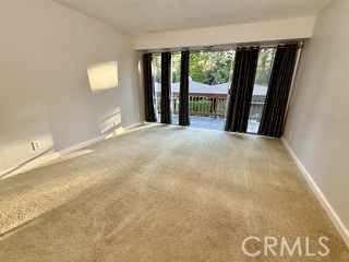 872 Sierra Vista Drive Twin Peaks, CA 92391 - Photo 24 of 37 an empty room with large windows