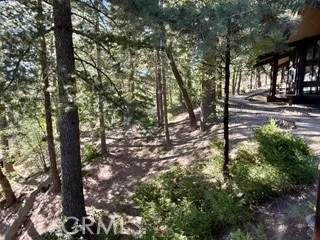 a bathroom with a sink and mirror with toilet