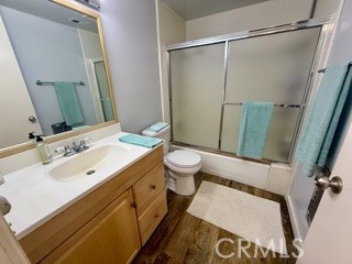 872 Sierra Vista Drive Twin Peaks, CA 92391 - Photo 37 of 37 a bathroom with a sink and mirror with toilet