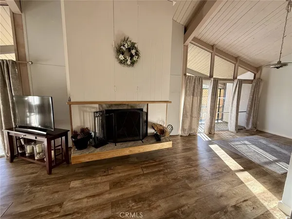 a view of a livingroom with furniture and a fireplace