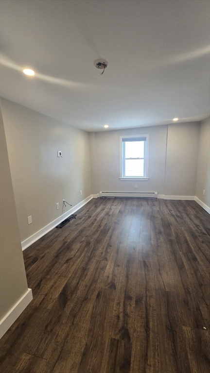 15 Central Street, Unit 4 Georgetown, MA 01833 - Photo 8 of 24 an empty room with wooden floor and windows