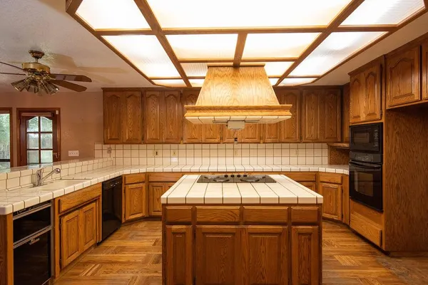 a kitchen with a stove and a sink
