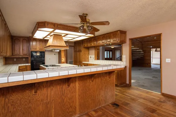 a kitchen with a stove and a refrigerator