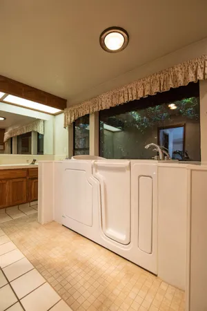 a kitchen with a sink and a refrigerator
