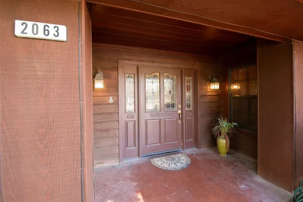 a view of balcony with furniture