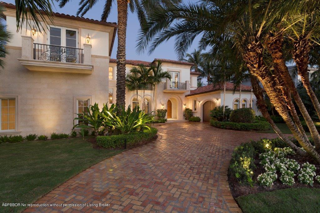 95 Curlew Road Manalapan, FL 33462 - Photo 2 of 36 a front view of a house with garden