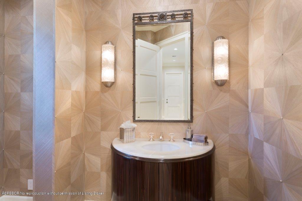 95 Curlew Road Manalapan, FL 33462 - Photo 12 of 36 a bathroom with a sink and a mirror
