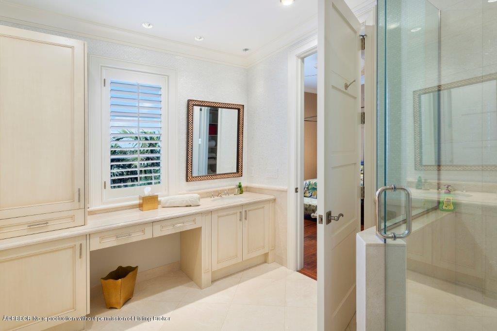 95 Curlew Road Manalapan, FL 33462 - Photo 20 of 36 a bathroom with a tub sink and mirror