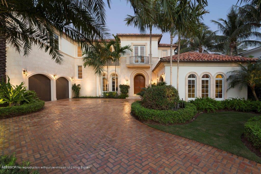 95 Curlew Road Manalapan, FL 33462 - Photo 3 of 36 a view of a white house with a large tree