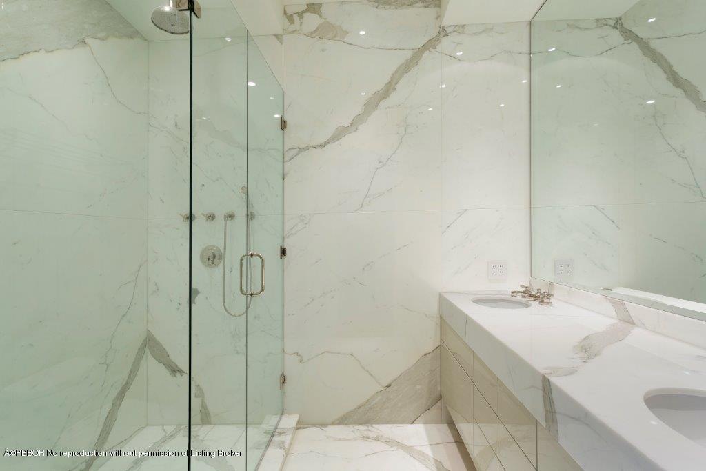 95 Curlew Road Manalapan, FL 33462 - Photo 22 of 36 a bathroom with a sink and shower