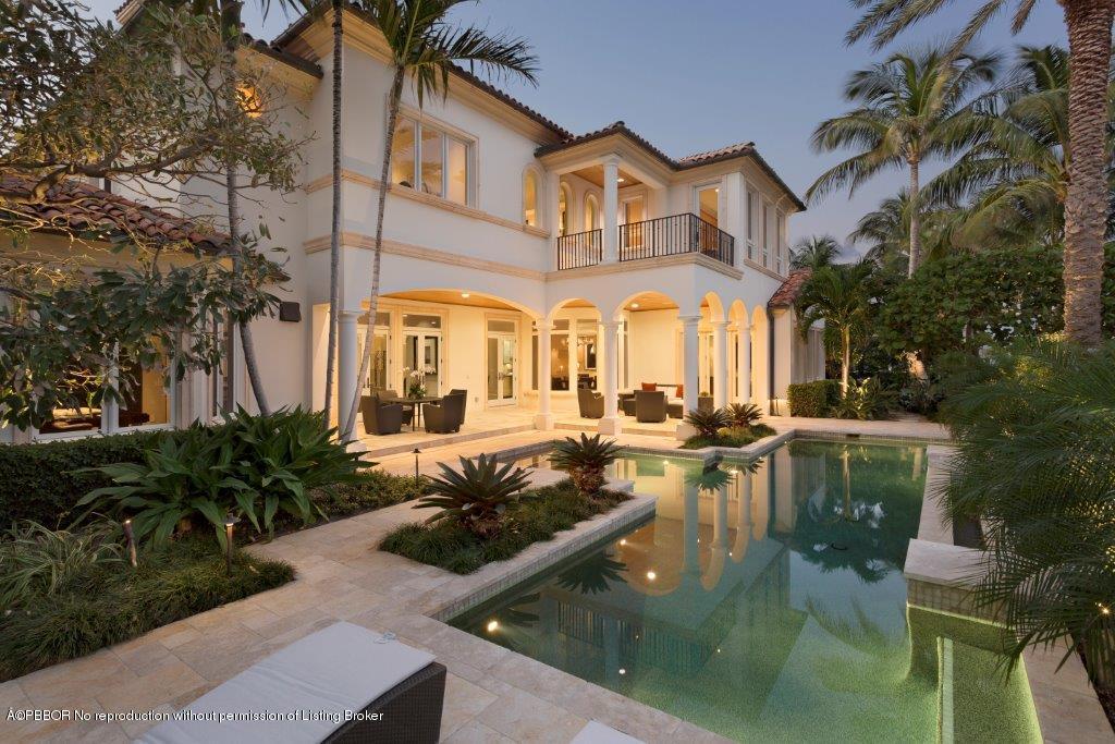 95 Curlew Road Manalapan, FL 33462 - Photo 27 of 36 a view of a white house with a large pool table and chairs