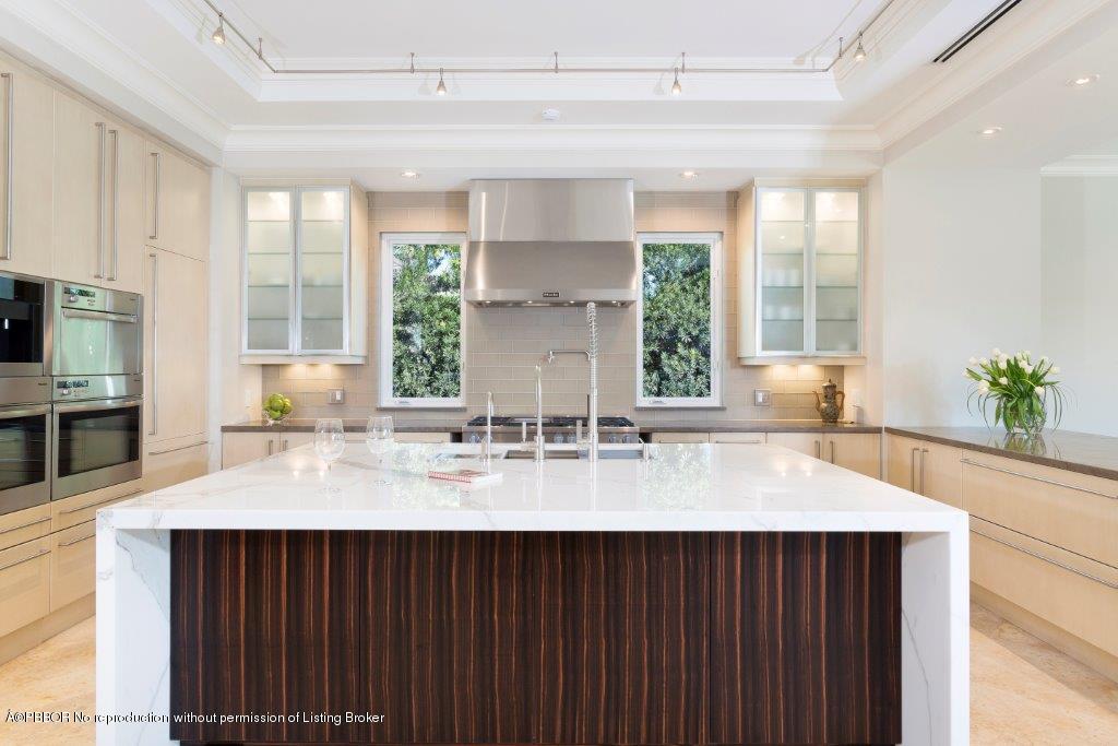 95 Curlew Road Manalapan, FL 33462 - Photo 6 of 36 a kitchen with sink refrigerator and window