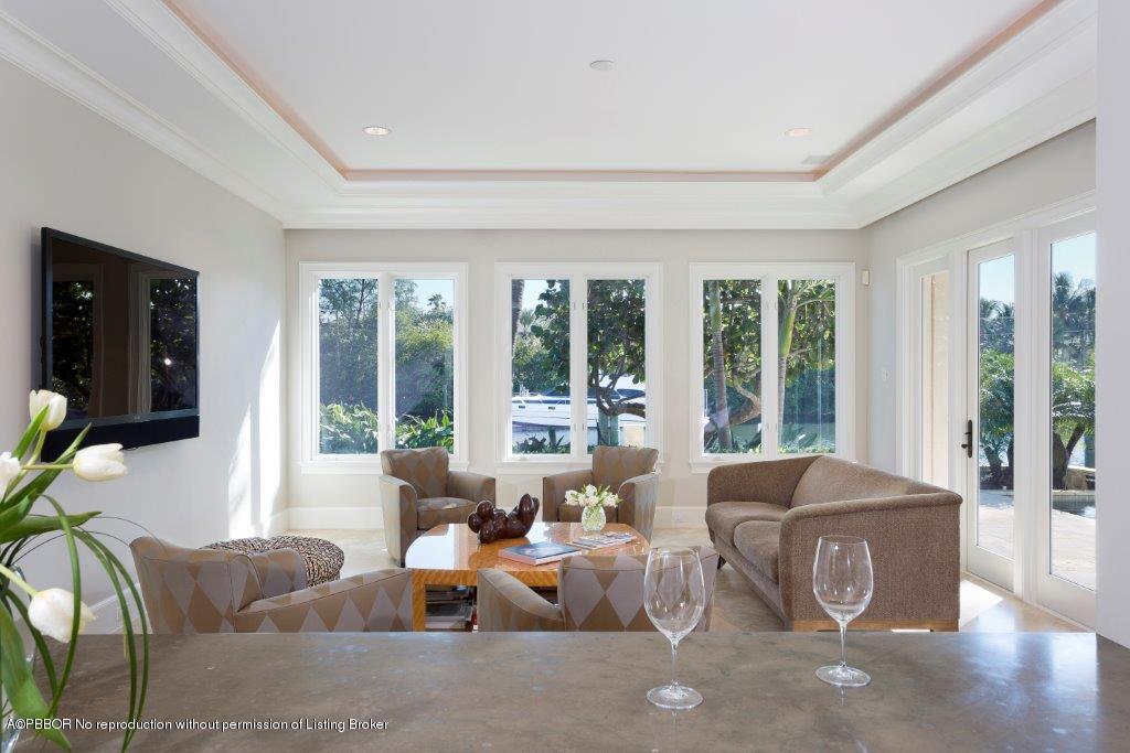95 Curlew Road Manalapan, FL 33462 - Photo 10 of 36 a living room with furniture and large windows