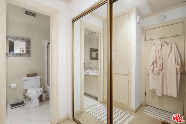 a bathroom with a glass shower door