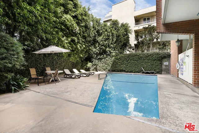 a view of a backyard with sitting area