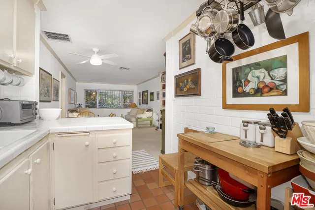 a kitchen with a stove and cabinets