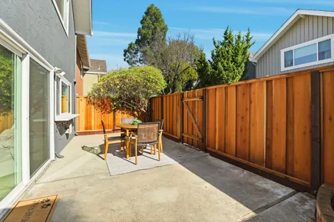 a patio with table and chairs