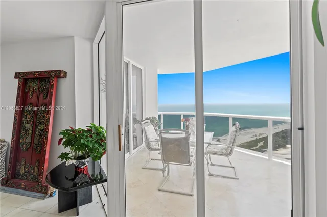 a room with furniture and potted plant