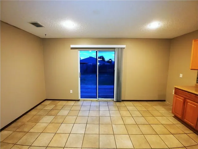 a stove top oven sitting inside of a kitchen