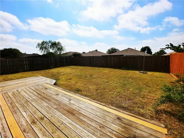a big house with pool in front of it