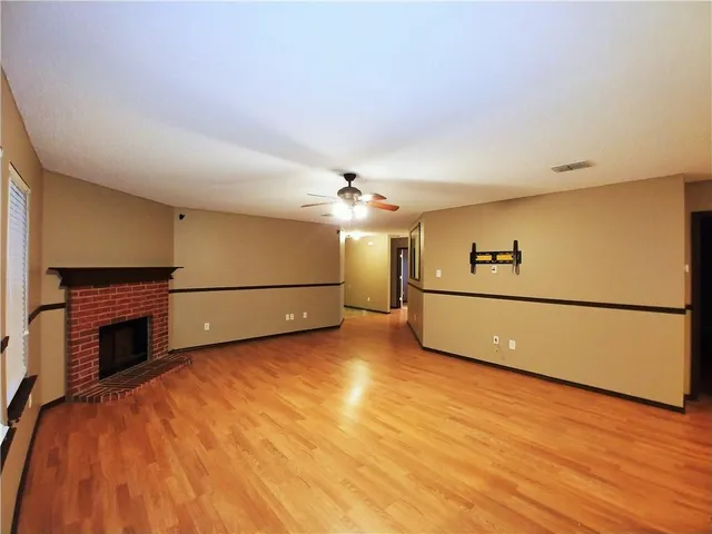 a view of a livingroom with an empty kitchen