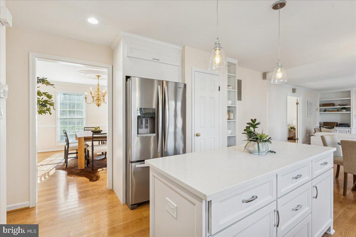 12546 Rock Ridge Road Herndon, VA 20170 - Photo 15 of 44 a kitchen with a refrigerator sink and white cabinets