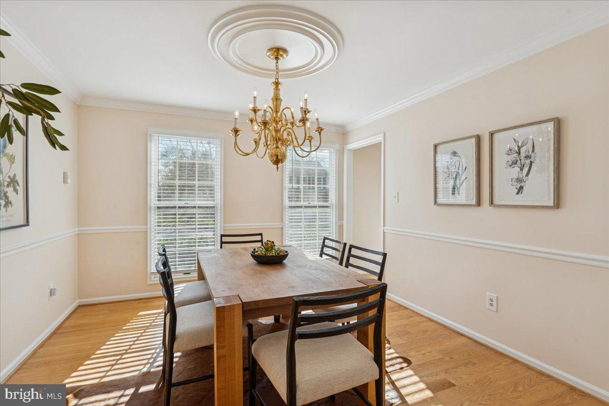 12546 Rock Ridge Road Herndon, VA 20170 - Photo 16 of 44 a view of a dining room with furniture and chandelier