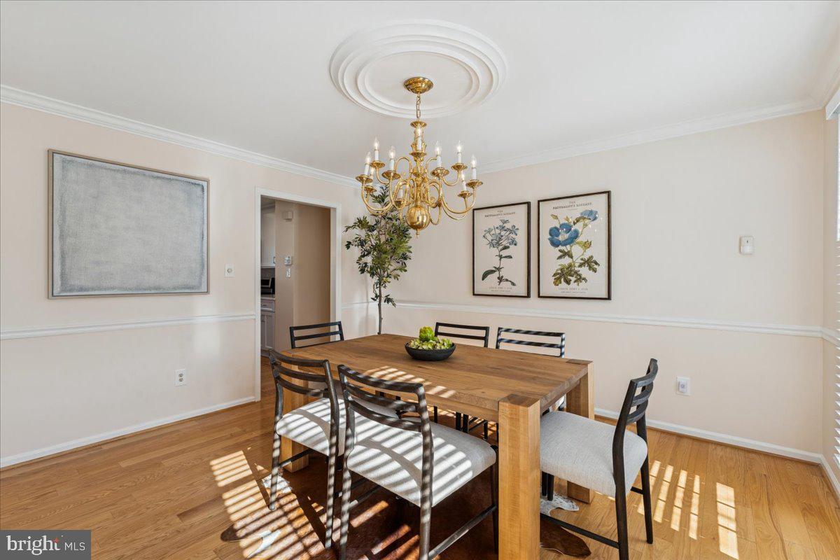 12546 Rock Ridge Road Herndon, VA 20170 - Photo 17 of 44 a view of a dining room with furniture and chandelier