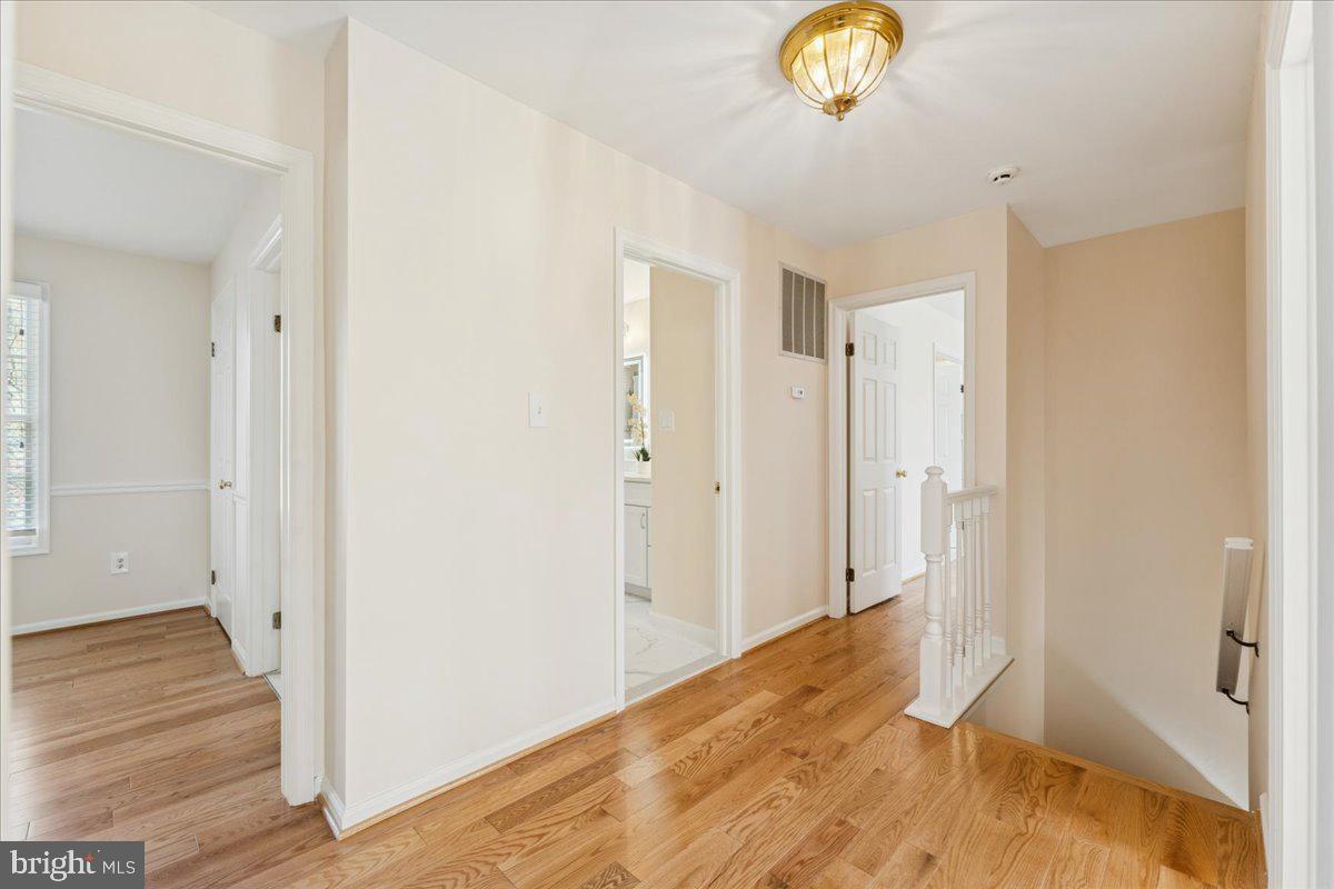 12546 Rock Ridge Road Herndon, VA 20170 - Photo 18 of 44 a view of empty room with wooden floor and window