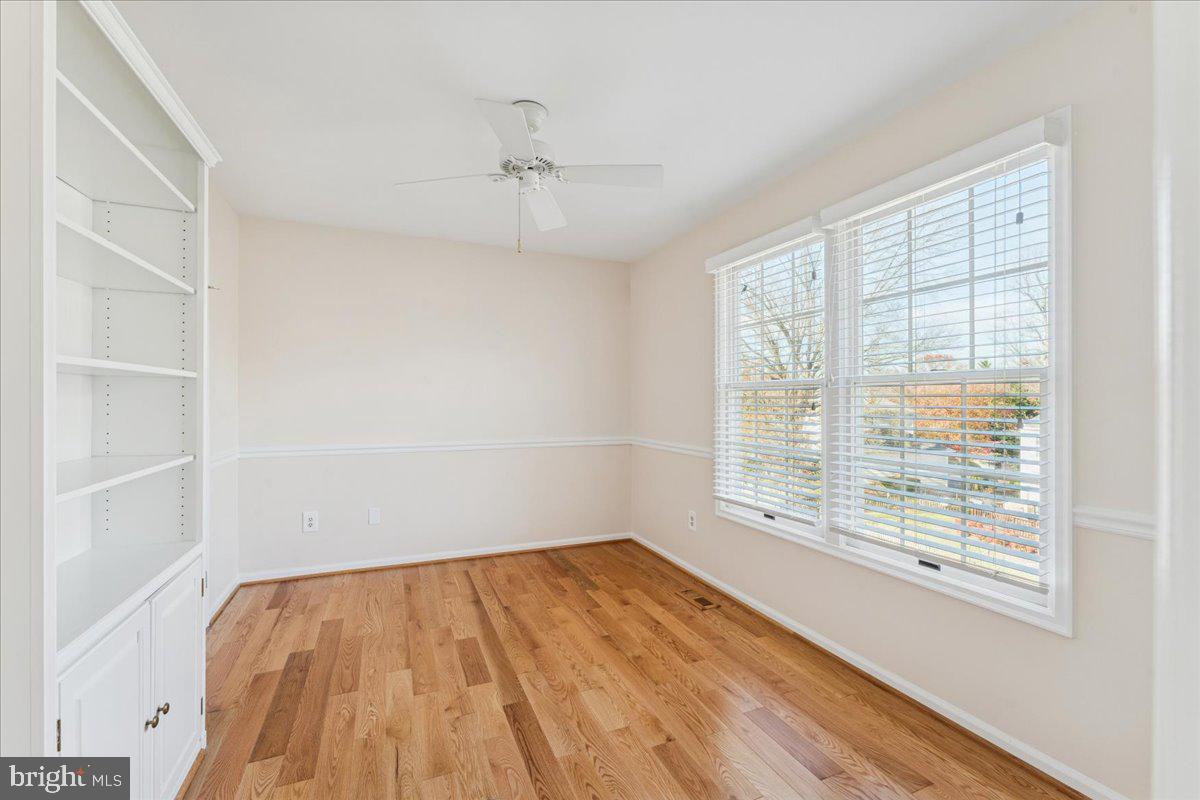 12546 Rock Ridge Road Herndon, VA 20170 - Photo 20 of 44 wooden floor in an empty room with a window