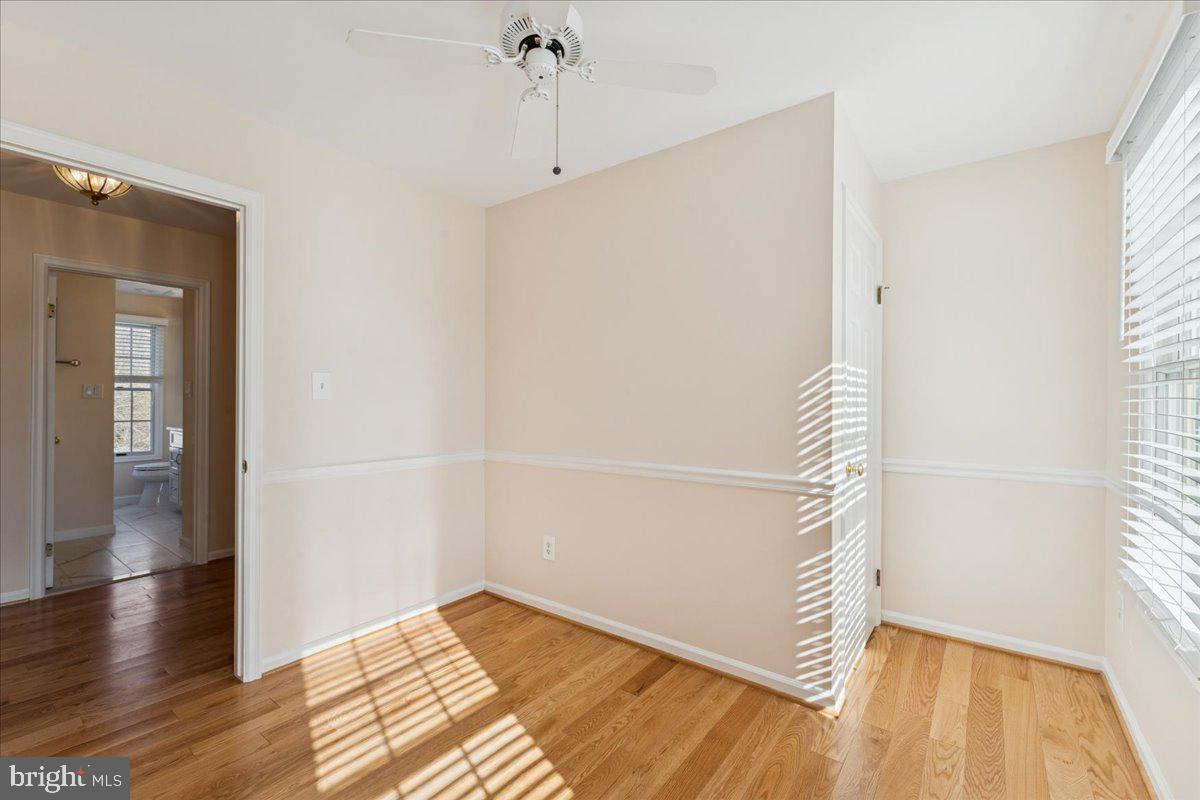 12546 Rock Ridge Road Herndon, VA 20170 - Photo 23 of 44 a view of an empty room with wooden floor and a window