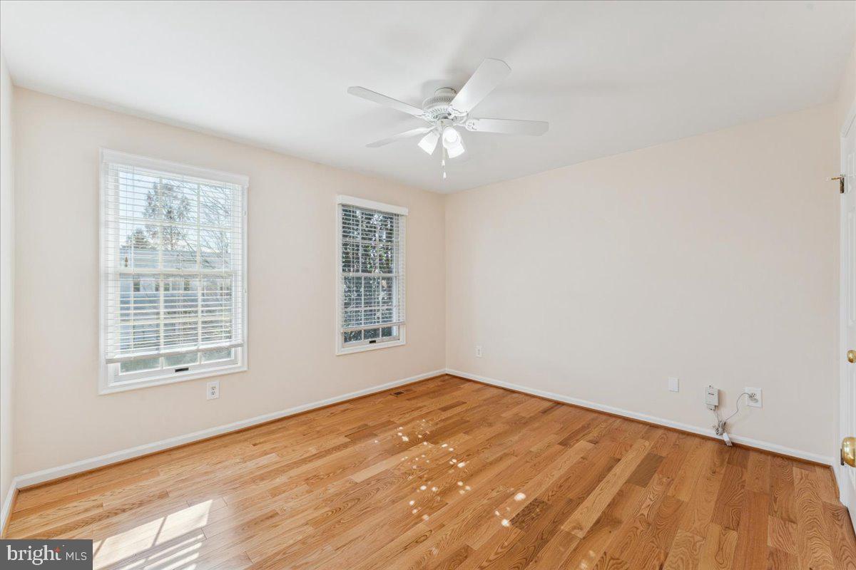 12546 Rock Ridge Road Herndon, VA 20170 - Photo 26 of 44 wooden floor in an empty room with a window