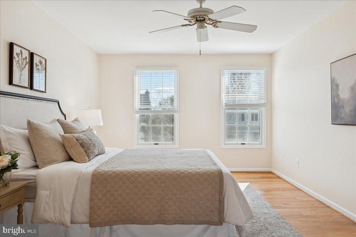 12546 Rock Ridge Road Herndon, VA 20170 - Photo 28 of 44 a bedroom with a large bed and a window