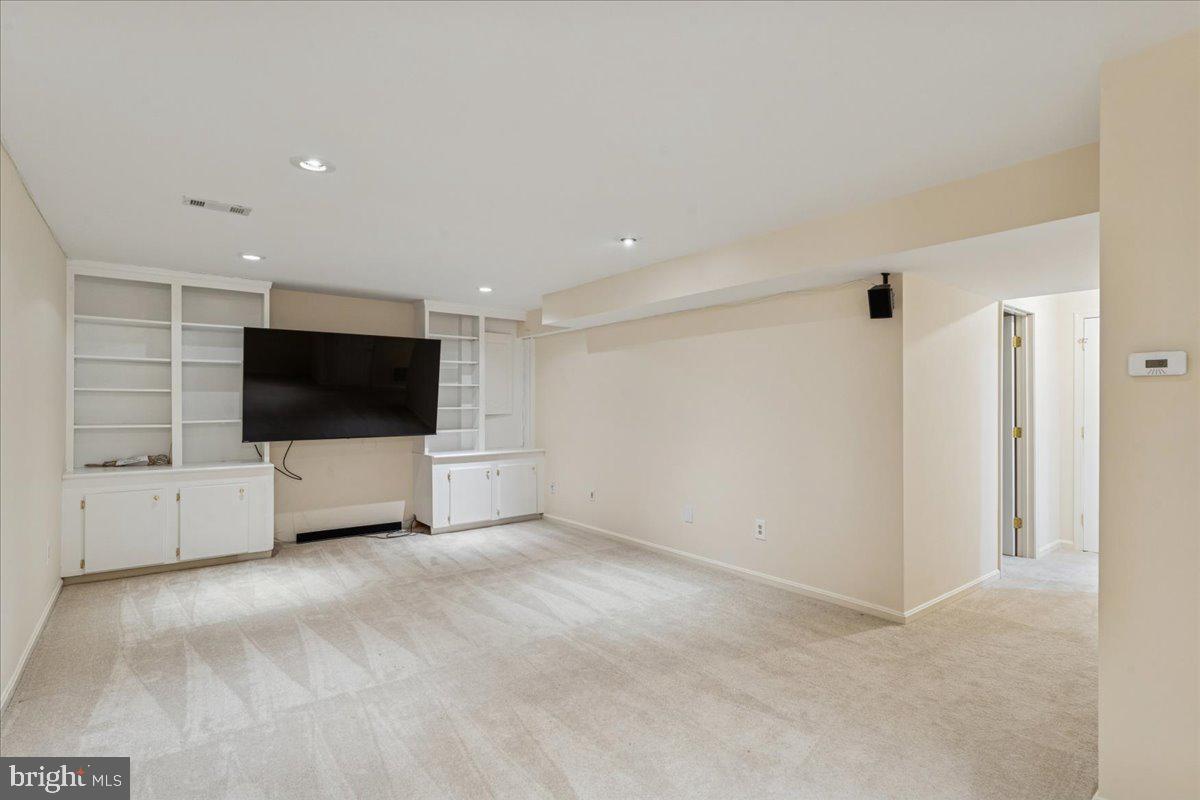 12546 Rock Ridge Road Herndon, VA 20170 - Photo 33 of 44 a living room with a flat screen tv and a couch