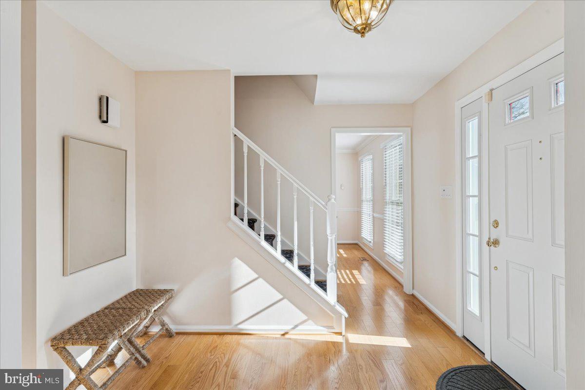 12546 Rock Ridge Road Herndon, VA 20170 - Photo 5 of 44 a view of entryway and hall with wooden floor