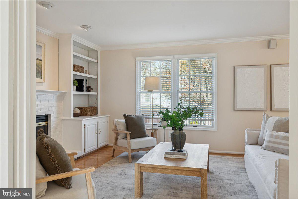 12546 Rock Ridge Road Herndon, VA 20170 - Photo 10 of 44 a living room with furniture and a potted plant