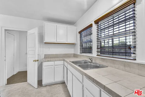 a kitchen with a stove and a refrigerator