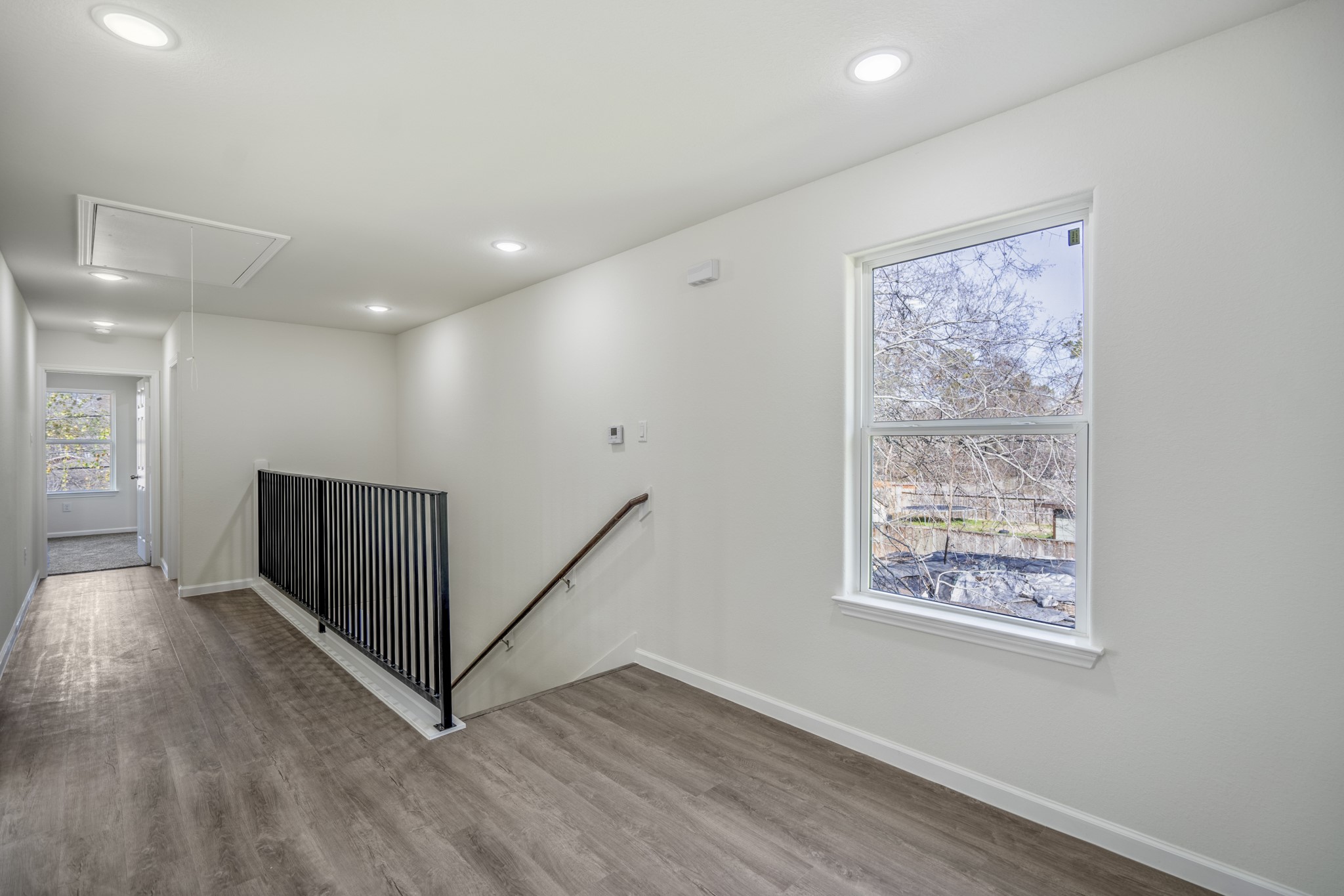 6513 Goldspier Street Houston, TX 77091 - Photo 11 of 31 wooden floor in an empty room with a window