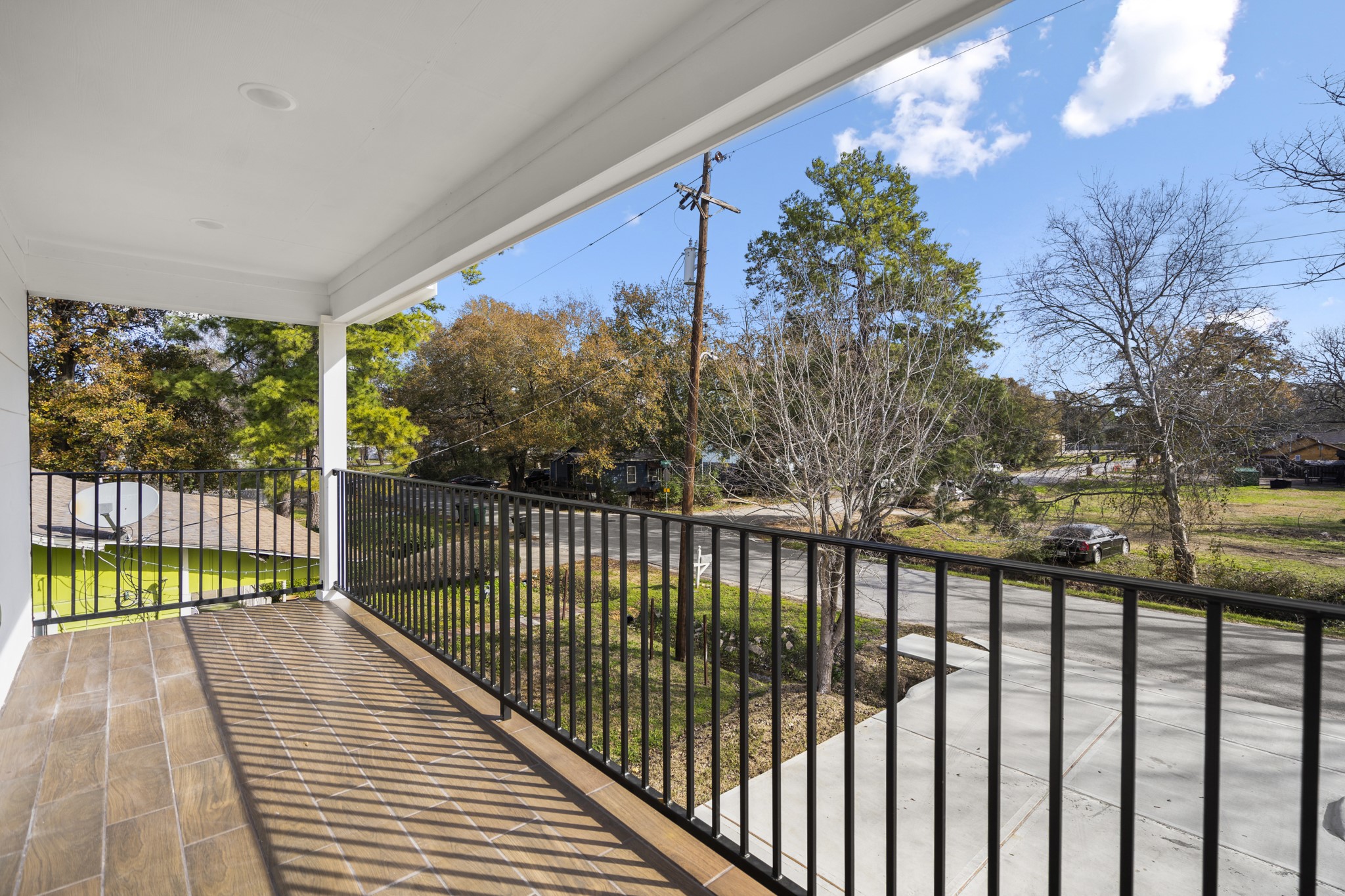 6513 Goldspier Street Houston, TX 77091 - Photo 20 of 31 a view of a balcony with wooden floor