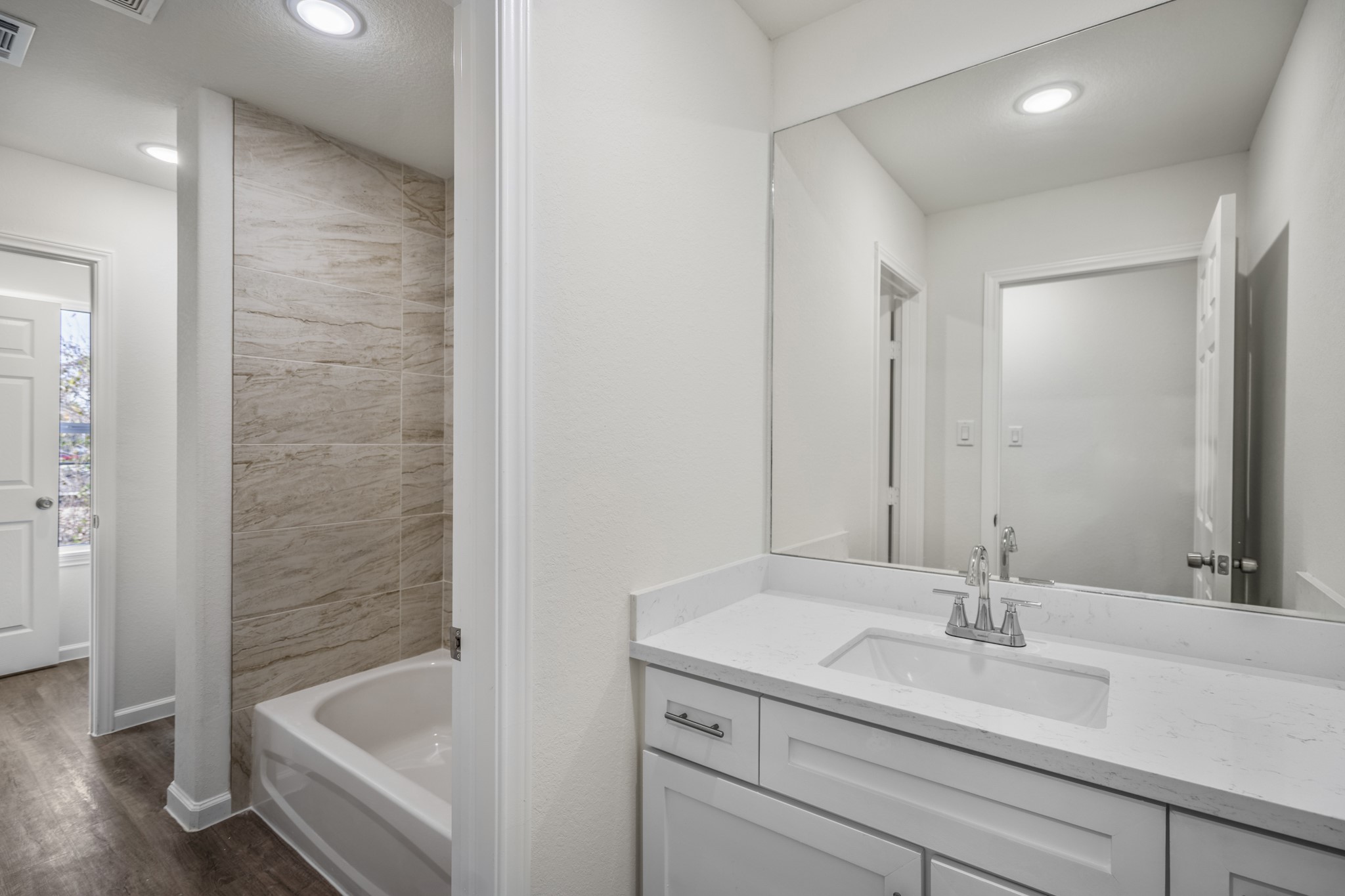 6513 Goldspier Street Houston, TX 77091 - Photo 23 of 31 a bathroom with a sink and a bathtub