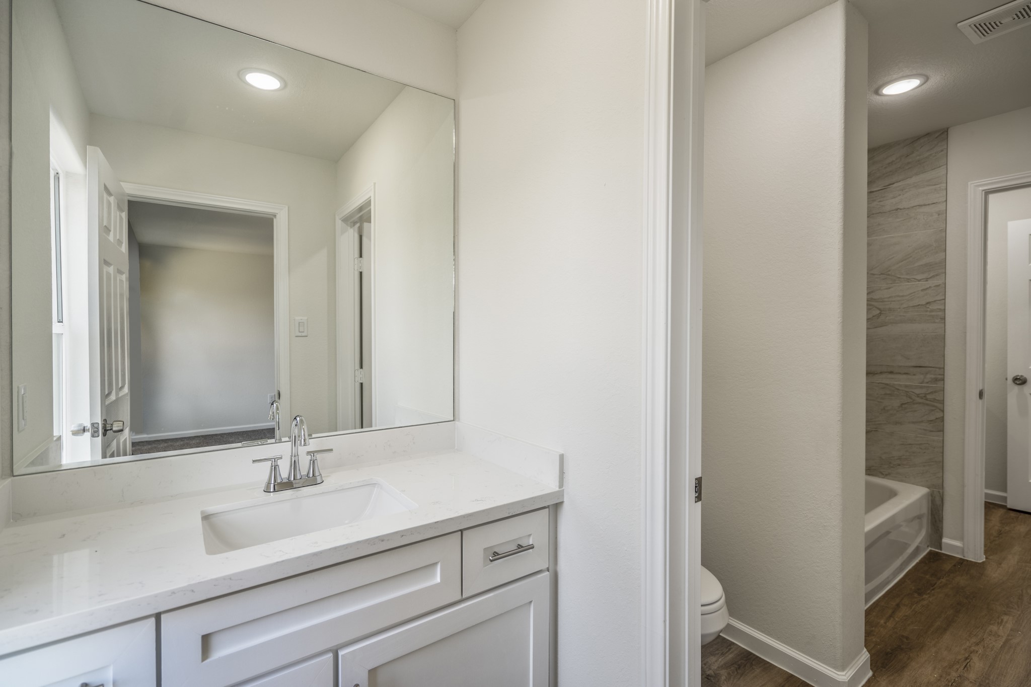 6513 Goldspier Street Houston, TX 77091 - Photo 26 of 31 a bathroom with a sink and a mirror
