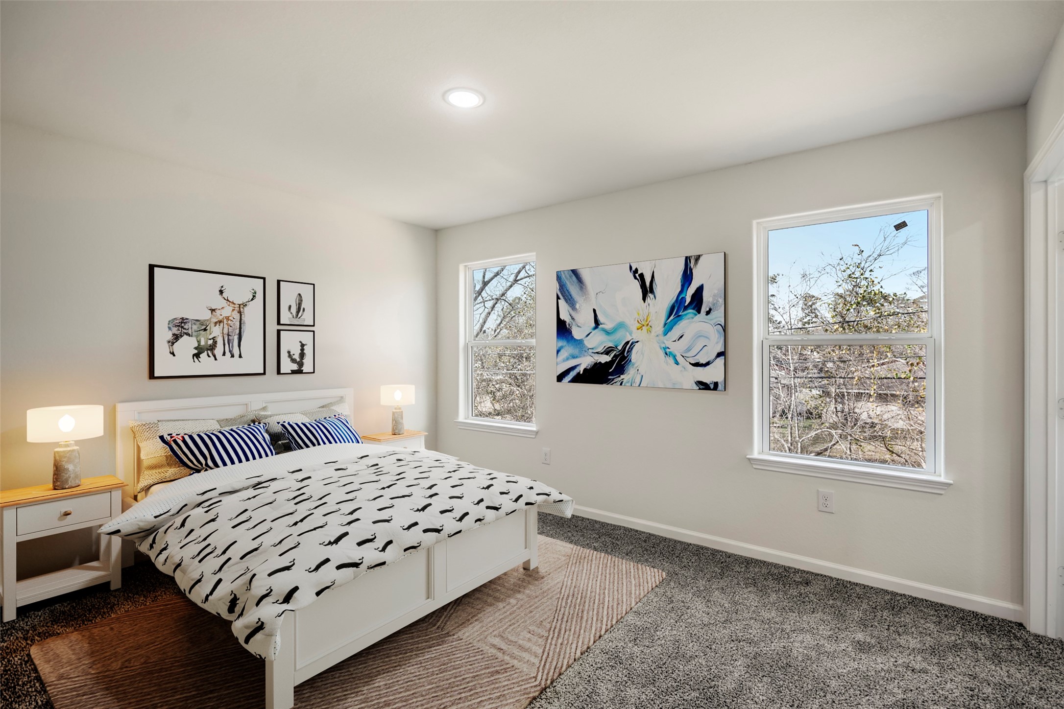 6513 Goldspier Street Houston, TX 77091 - Photo 27 of 31 a bedroom with a large bed and a painting on the wall