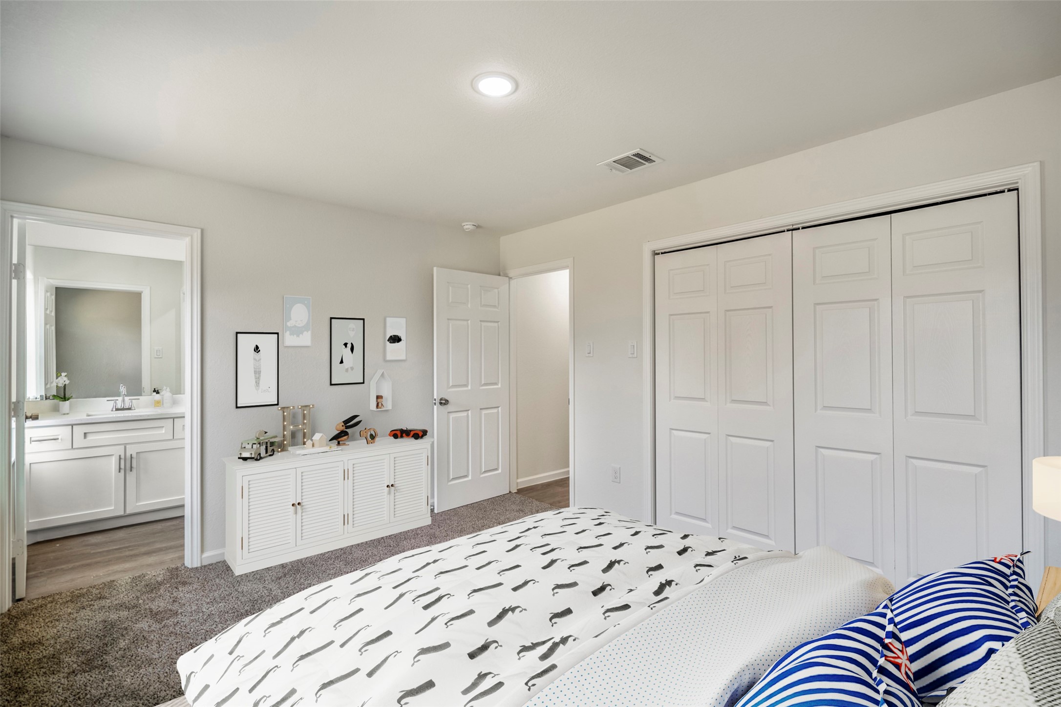 6513 Goldspier Street Houston, TX 77091 - Photo 28 of 31 a bedroom with a white bed and dresser