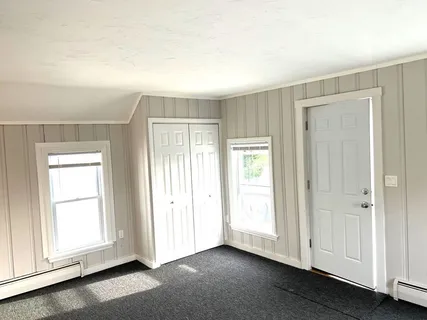 a view of an empty room and window