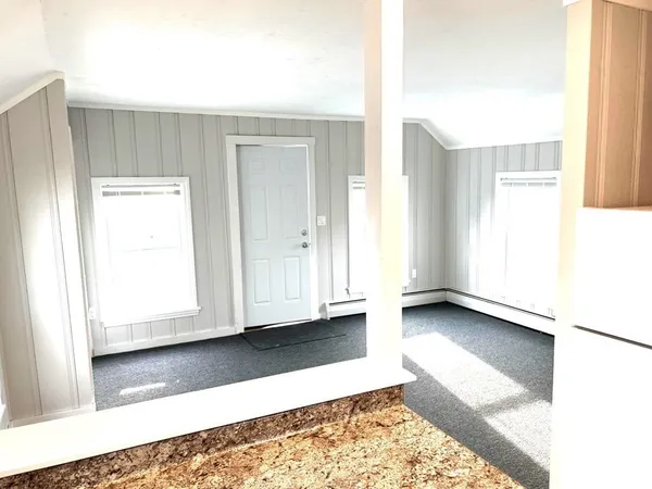 a view of kitchen with granite countertop cabinets