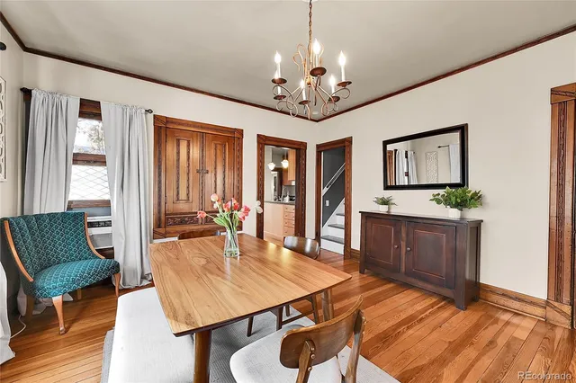 a view of a dining room with furniture window and wooden floor