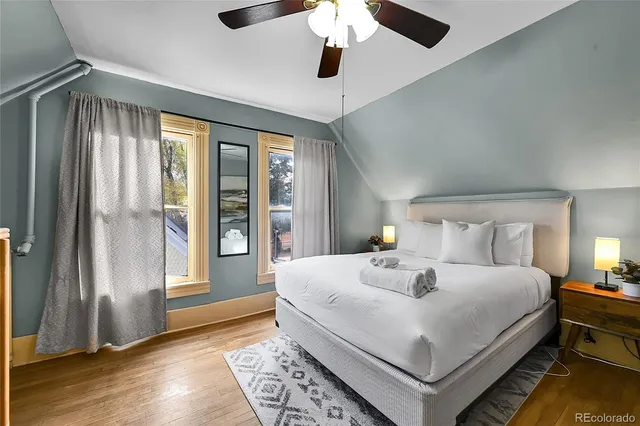 a bedroom with a large bed and a window